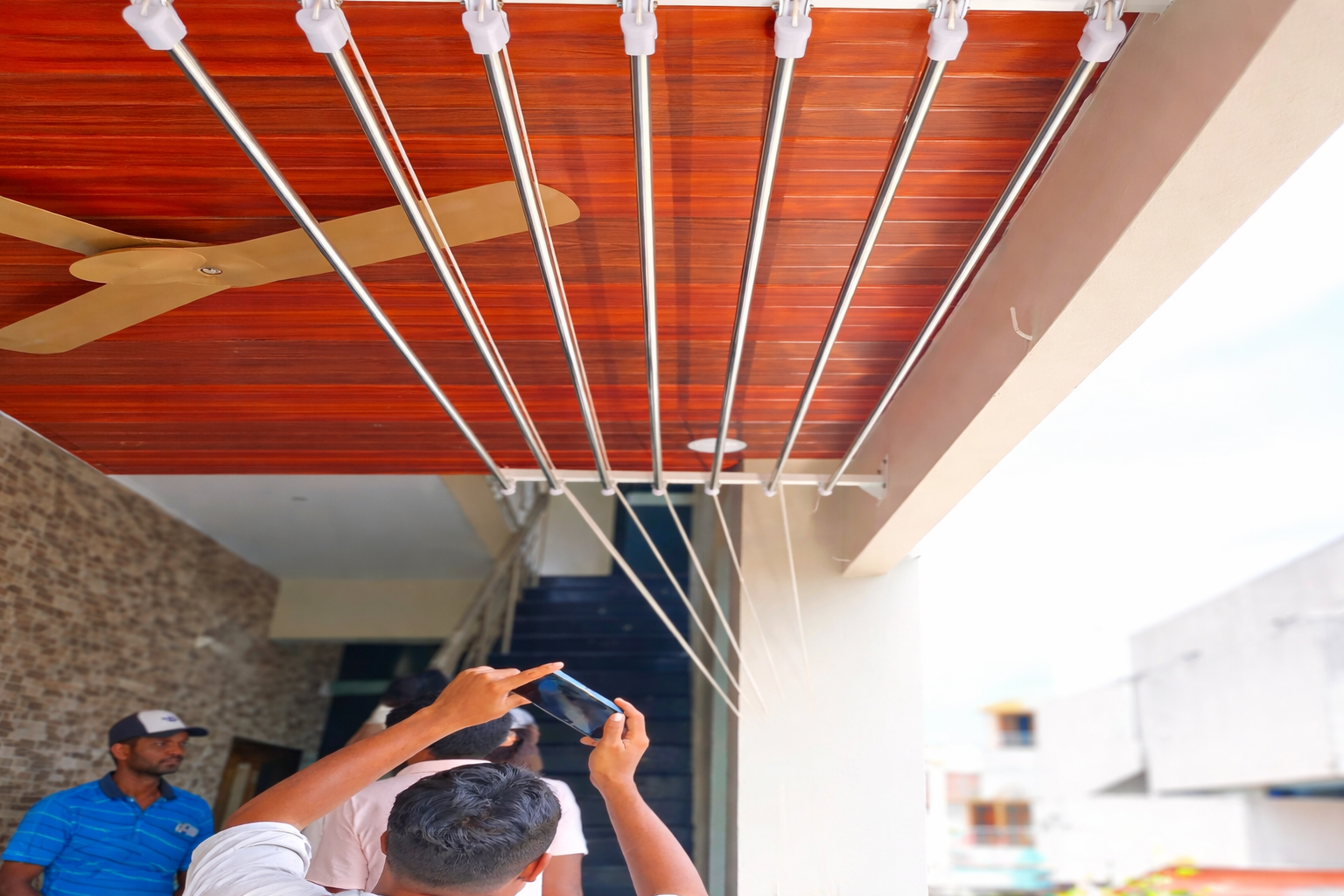 Ceiling cloth hanger system in a balcony